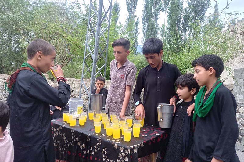 Volunteers distributing sabeel among the participant of the Majlis-e-Aza during the holy month of Muharrum-ul-Haram