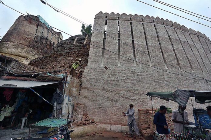 A labour busy in construction work of Pakka Fort