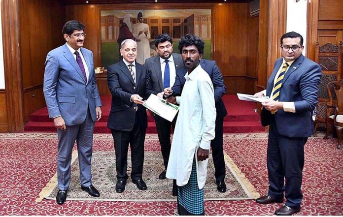 Prime Minister Muhammad Shehbaz Sharif distributing keys of newly constructed houses donated by HBL among the Flood affectees of Sindh