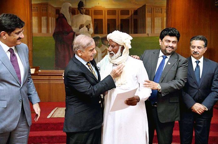 Prime Minister Muhammad Shehbaz Sharif distributing keys of newly constructed houses donated by HBL among the Flood affectees of Sindh