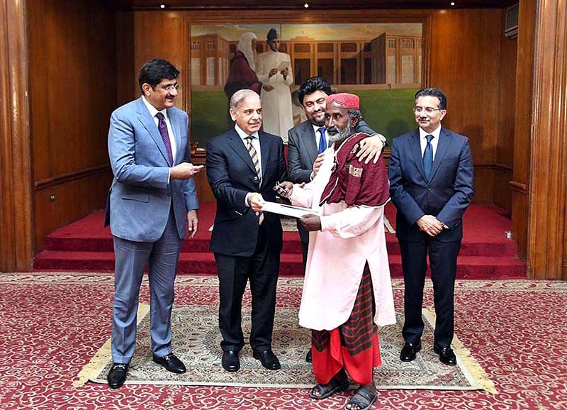 Prime Minister Muhammad Shehbaz Sharif distributing keys of newly constructed houses donated by HBL among the Flood affectees of Sindh