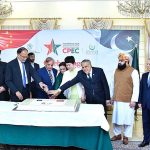 Prime Minister Muhammad Shehbaz Sharif, Chargé d'affaires of the Chinese Embassy in Islamabad Ms. Pang Chunxue and Federal Ministers cutting a cake marking the 10th anniversary of the signing of the agreement for CPEC