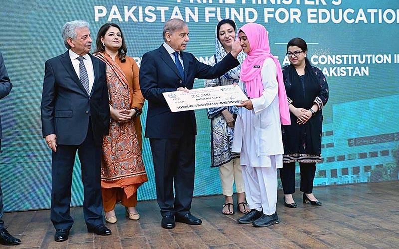Prime Minister Muhammad Shehbaz Sharif distributes scholarship cheques among high-achieving students on merit basis under the Pakistan Endowment Fund for Education