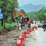 During the expansion work of Club Road, heavy machinery is being utilized to carry out the construction and development tasks.