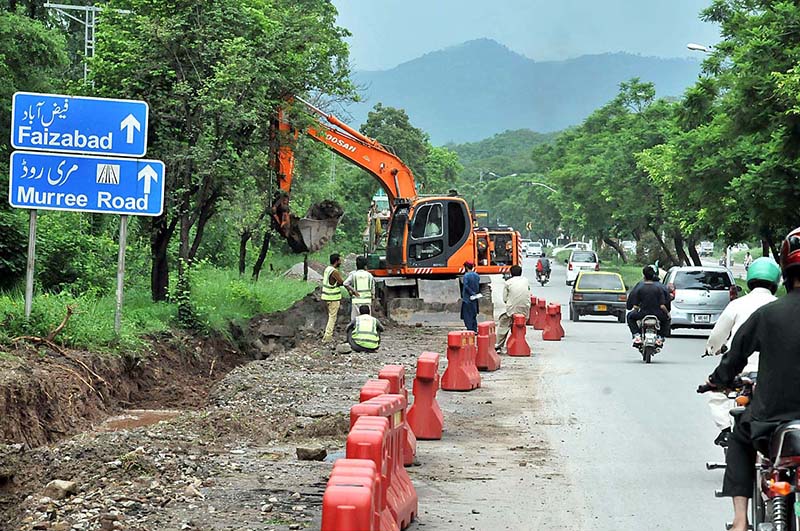 During the expansion work of Club Road, heavy machinery is being utilized to carry out the construction and development tasks.