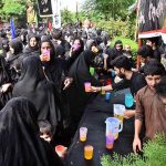 Volunteers serving Sabeel (special drinks) during the main procession of 9th Muharram-ul-Haram observing Youm-e-Ashura at G-6 Road. Muharram ul Harram, the first month of the Islamic calendar is known as the mourning month to pay homage in remembrance of the martyrdom (Shahadat) of Hazrat Imam Hussain (AS), the grandson of the Holy Prophet Mohammad (SAWW), along with his family members and companions at the battle of Karbala
