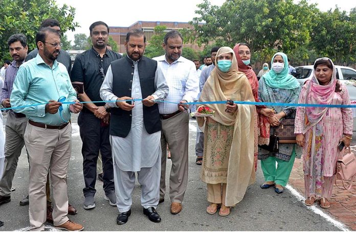 Secretary Higher Education South Punjab Muhammad Altaf Baloch cutting ribbon to inaugurate Miyawaki tree Plantation in the Government Graduate Home Economic College Madni Chowk
