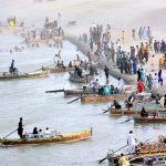 A large number of visitors enjoying boat riding at Almanzar Picnic Point at River Indus on the 3nd day of Eid-ul-Adha celebrations