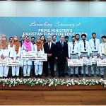 Prime Minister Muhammad Shehbaz Sharif in a group photo with the beneficiaries of Pakistan Endowment Fund for Education