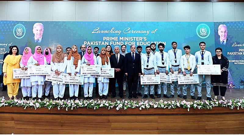 Prime Minister Muhammad Shehbaz Sharif in a group photo with the beneficiaries of Pakistan Endowment Fund for Education