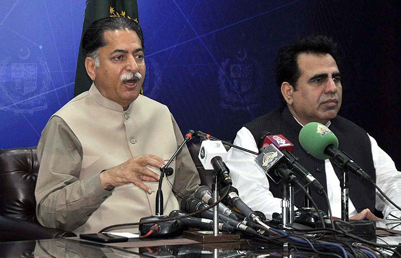 Federal Minister Mian Javed Latif addresses to the Media persons during a press conference at PIDC