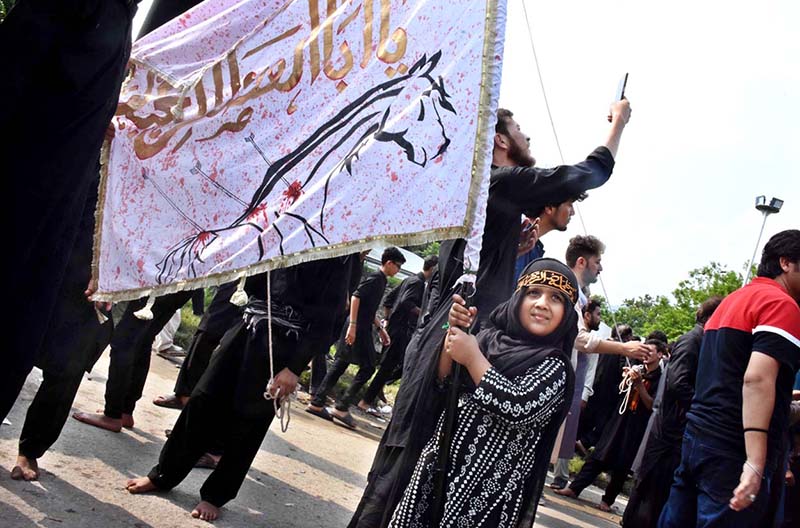 Volunteers serving Sabeel (special drinks) during the main procession of 9th Muharram-ul-Haram observing Youm-e-Ashura at G-6 Road. Muharram ul Harram, the first month of the Islamic calendar is known as the mourning month to pay homage in remembrance of the martyrdom (Shahadat) of Hazrat Imam Hussain (AS), the grandson of the Holy Prophet Mohammad (SAWW), along with his family members and companions at the battle of Karbala