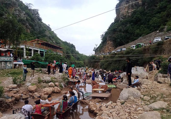 A large number of people enjoying picnic at Shahdara valley near outskirts of the Federal Capital