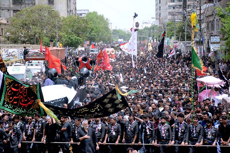 A large number of Shiite Muslims participate in 10th Muharram procession to mark Ashoura at Mehfil-e-Husseini Road. Ashoura is the commemoration marking the Shahadat (death) of Hussein (AS), the grandson of the Prophet Muhammad (PBUH), with his family members during the battle of Karbala for the upright of Islam