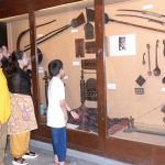 Visitors viewing displayed artworks at Lahore Museum