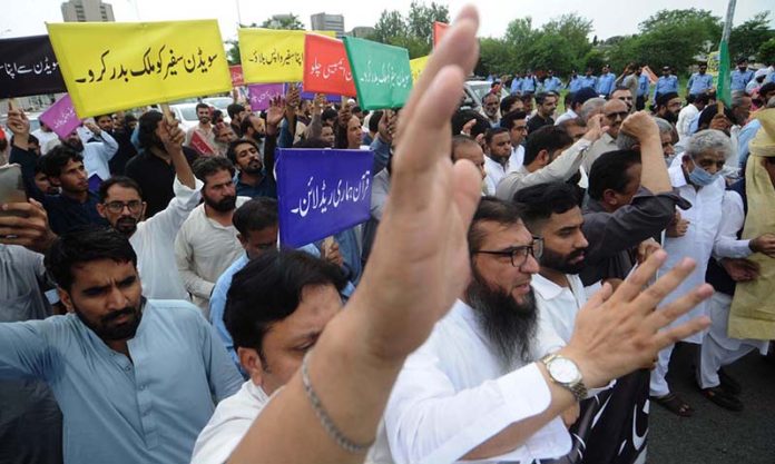 All Pakistan Traders association and Traders action Committee holding the protest during Quran Sanctification Day outside Islamabad press club as they protest against the burning of the Quran outside a Stockholm mosque that outraged Muslims around the world