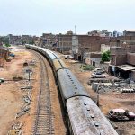 A beautiful view of train crossing the resident area at Latifabad