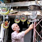 A vendor displaying stuff in connection with Ashura at Almdar Road