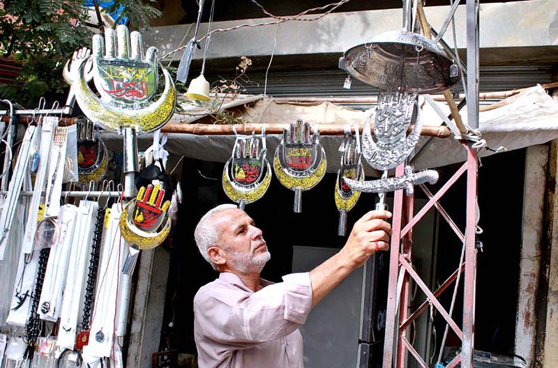 A vendor displaying stuff in connection with Ashura at Almdar Road