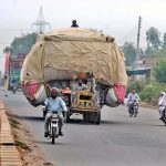 Tractor trolley is heavily loaded with chaff (husk from wheat near Bahawalpur Bypass which may cause any mishap and needs attention to concern authority