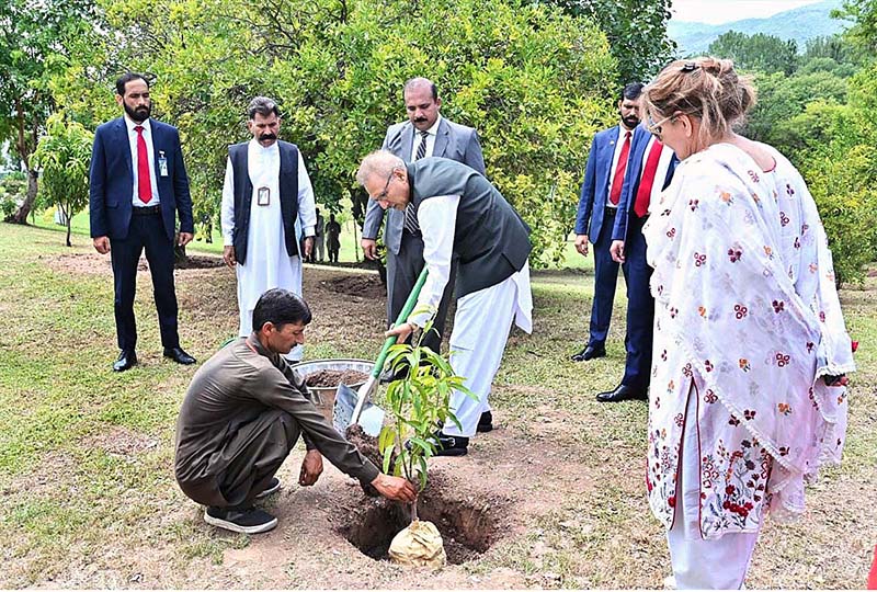 President Dr. Arif Alvi planting a sapling as part of monsoon plantation season at Aiwan-e-Sadr