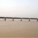 A view of Indus River level continuously rising after the rains in the country at Kotri Railway Bridge