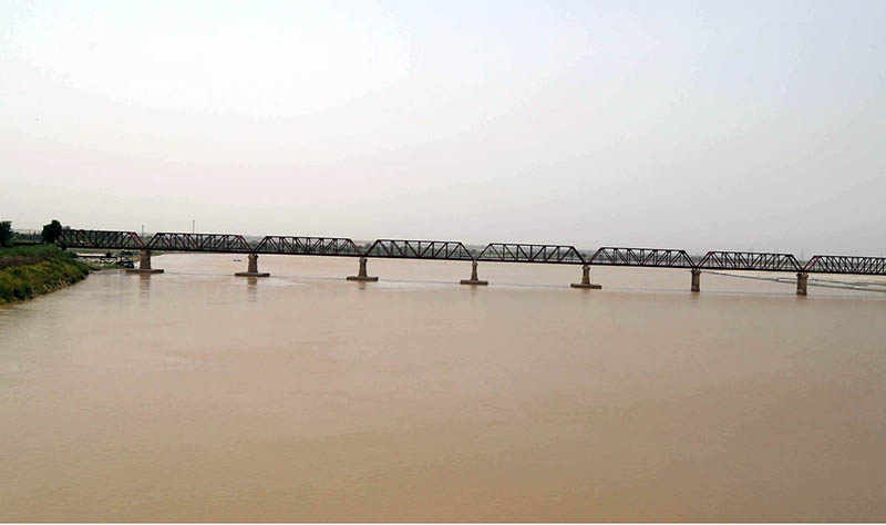 A view of Indus River level continuously rising after the rains in the country at Kotri Railway Bridge