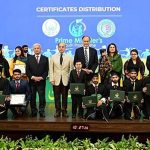 Prime Minister Muhammad Shehbaz Sharif in a group photo with successful candidates of Prime Minister's Youth Skill Development Program