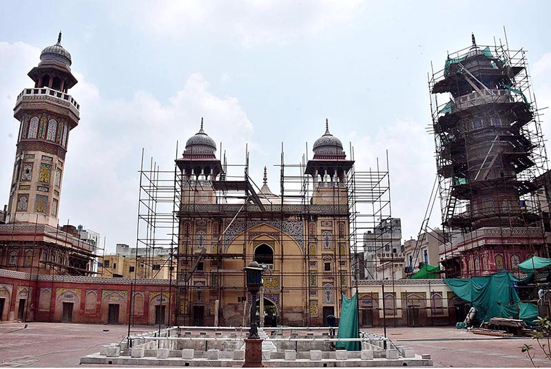 Labourers renovation work at historical Mosque Masjid Wazir Khan at Walled. The Wazir Khan Mosque is 17th century. The mosque was commissioned during the reign of the Mughal Emperor Shah Jahan as part of an ensemble of buildings that also included the nearby Shahi Hammam baths. Construction of Wazir Khan Mosque began in 1634 C.E., and was completed in 1641