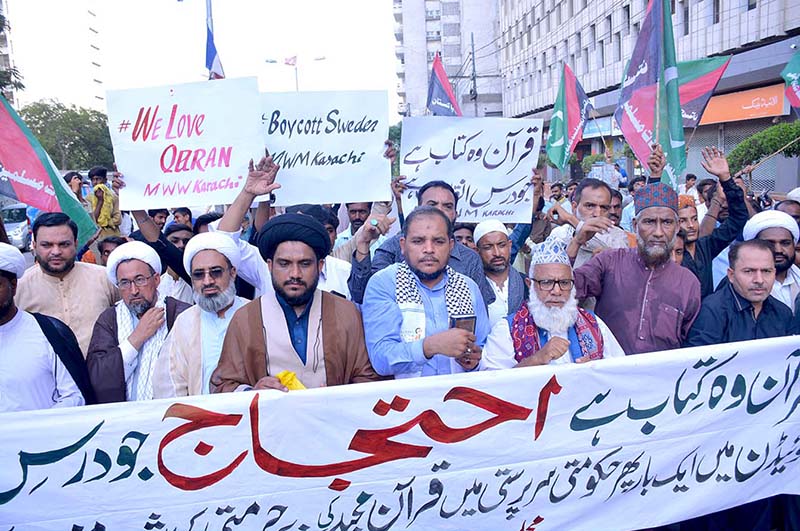 Activists of Majlis Wahdat-e-Muslimeen take part in a protest demonstration at Karachi Press Club against the burning of holy Quran outside a Stockholm Mosque