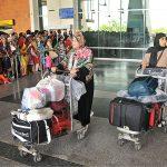 Pilgrims coming out from the airport as First Hajj flight landed after performing Hajj at Multan International Airport