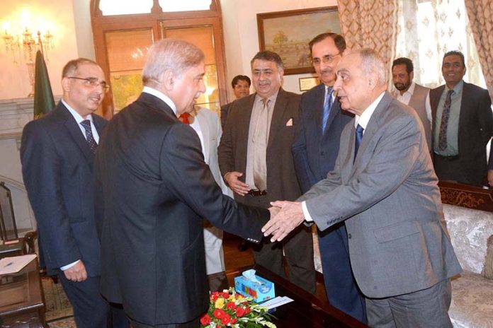 Prime Minister Shehbaz Sharif interacts with the members of the Chamber Of Commerce delegation at Governor House