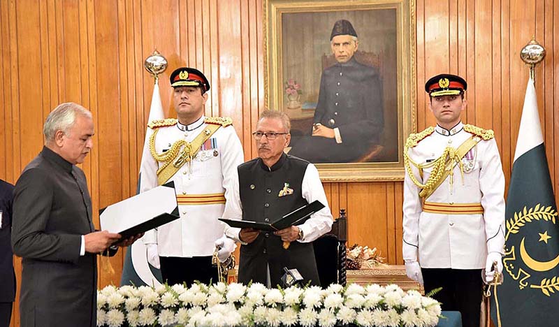 President Dr. Arif Alvi administering the oath of the office to Catain (r) Shahid Ashraf Tarar as the Chairman of the Federal Public Service Commission during an oath-taking ceremony at Aiwan-e-Sadr