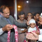 Deputy Commissioner (DC) Ali Anan Qamar receiving the pilgrims warmly with flower garlands as first hajj flight landed at Faisalabad International Airport during post hajj operation
