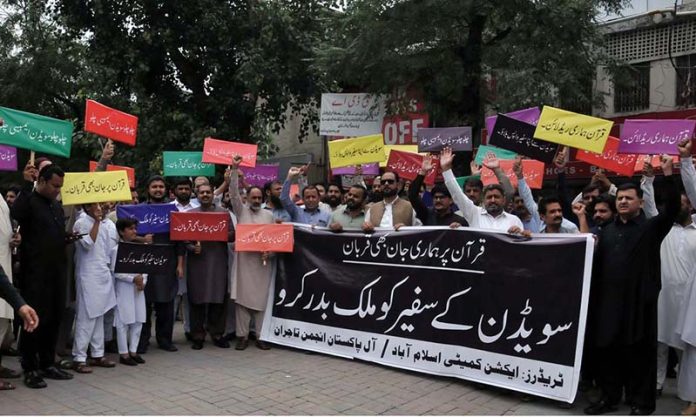 All Pakistan Traders association and Traders action Committee holding the protest during Quran Sanctification Day at Abpara, as they protest against the burning of the Quran outside a Stockholm mosque that outraged Muslims around the world