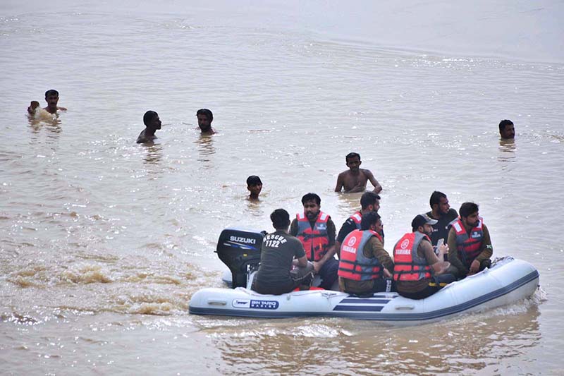 Rescue 1122 team in search of the bodies of three boys who drowned in the River Indus at bypass area