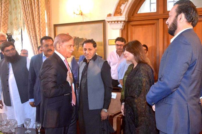 Prime Minister Shehbaz Sharif interacts with the members of the Chamber Of Commerce delegation at Governor House