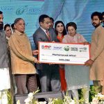 Prime Minister Muhammad Shehbaz Sharif distributing cheques among the recipients of Prime Minister's Youth Business and Agriculture Loan Scheme