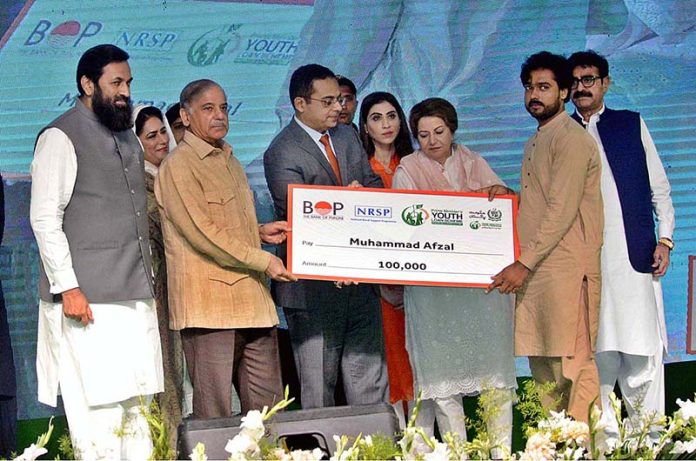 Prime Minister Muhammad Shehbaz Sharif distributing cheques among the recipients of Prime Minister's Youth Business and Agriculture Loan Scheme Prime Minister Muhammad Shehbaz Sharif distributing cheques among the recipients of Prime Minister's Youth Business and Agriculture Loan Scheme