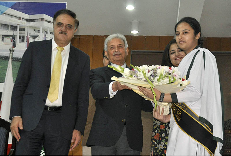 Federal Minister for Education & Professional Training Rana Tanveer Hussain giving gift hamper to position holder during the Result Declaration ceremony SSC Part I&II 1st Annual Exam 2023 at FBISE