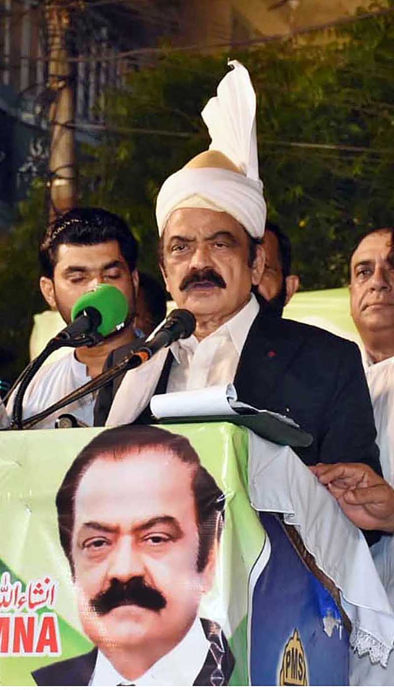 Interior Minister Rana Sana Ullah Khan addressing a public gathering at Chak No. 70 JB