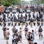 Security personnel high alert during the 10th Muharram procession to mark Ashoura at M.A Jinnah Road. Ashoura is the commemoration marking the Shahadat (death) of Hussein (AS), the grandson of the Prophet Muhammad (PBUH), with his family members during the battle of Karbala for the upright of Islam