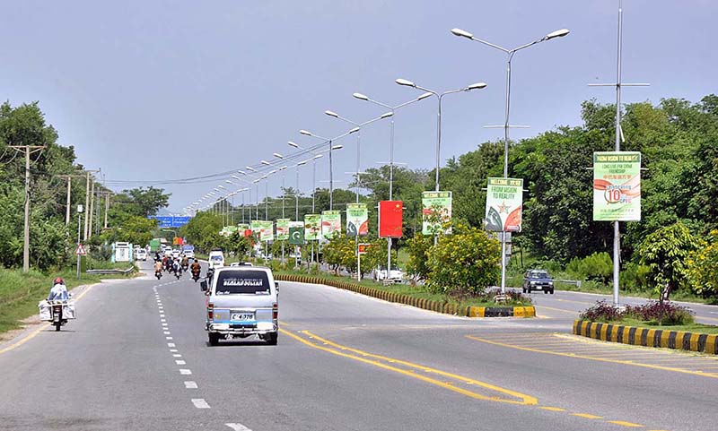 Billboard and Pak-China flags are being displayed at Srinagar Highway in connection with 10 years celebration of CPEC