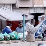 Worker waiting for clients at Pirwadhai Sabzi Mandi