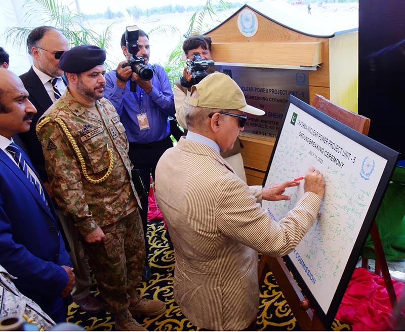 Prime Minister Muhammad Shehbaz Sharif signing a commemorative board during the groundbreaking ceremony of the 5th unit of Chashma Nuclear Power plant (C-5) in Chashma