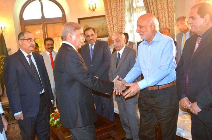 Prime Minister Shehbaz Sharif interacts with the members of the Chamber Of Commerce delegation at Governor House