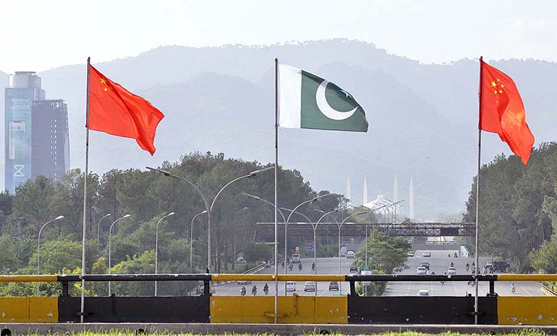 Billboard and Pak-China flags are being displayed at Srinagar Highway in connection with 10 years celebration of CPEC