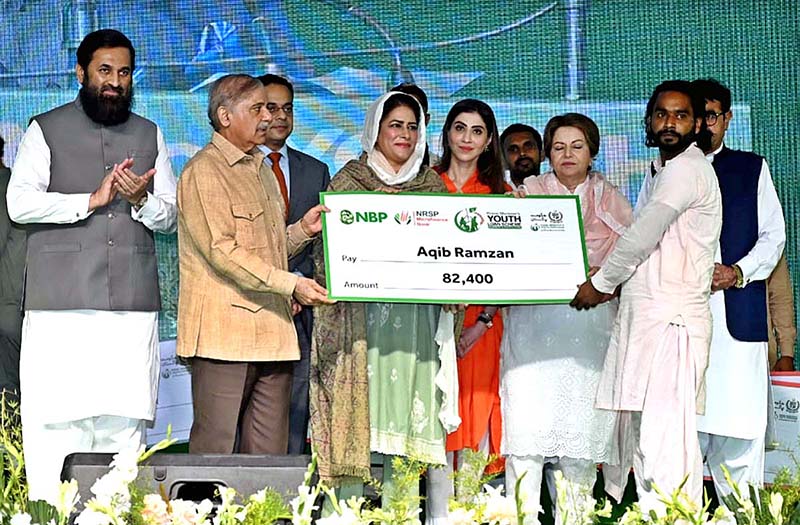 Prime Minister Muhammad Shehbaz Sharif distributing cheques among the recipients of Prime Minister's Youth Business and Agriculture Loan Scheme