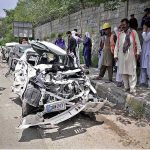 View of badly damaged vehicles struck by an out of control Dumper Truck near Lahore High Court Bench at Swan area in the outskirts of the city