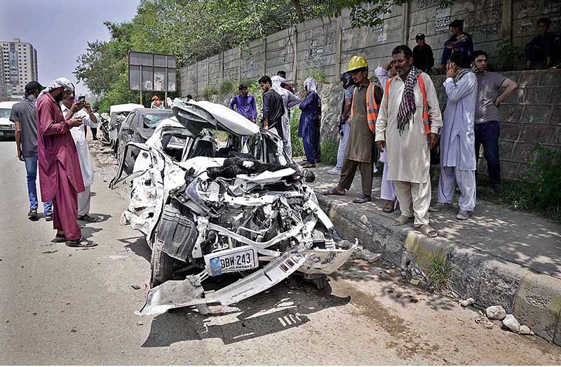 View of badly damaged vehicles struck by an out of control Dumper Truck near Lahore High Court Bench at Swan area in the outskirts of the city